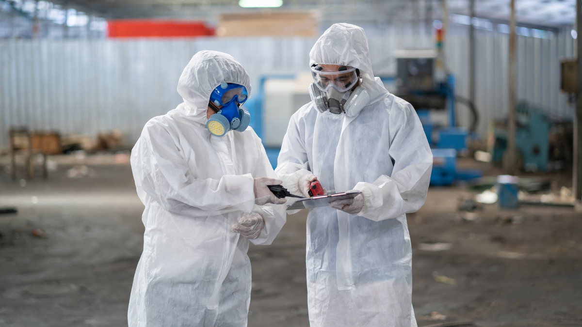 Rubber glove manufacturing facility with environmental monitoring tools tracking air quality, effluent discharge, and waste management compliance.